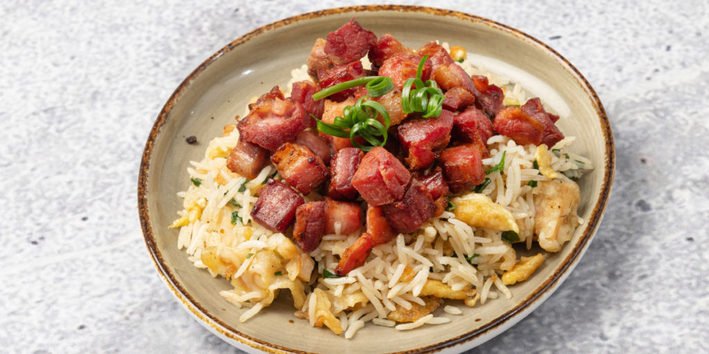 Fried rice topped with Smoked Bacon Cubes